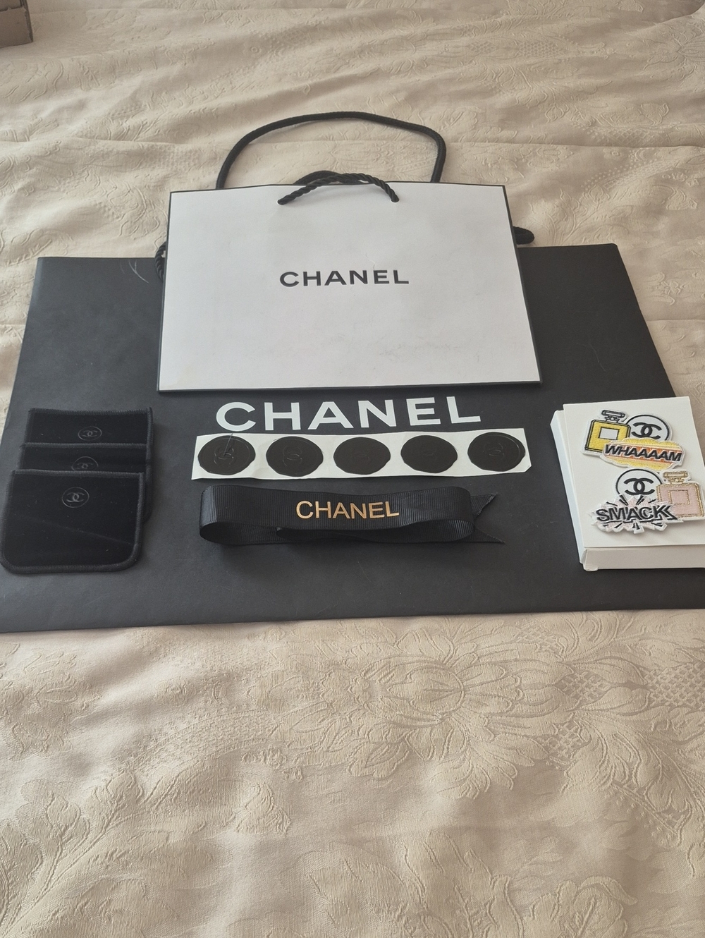 CHANEL Bundle: Shopping Bags, Pins, Ribbon And Stickers